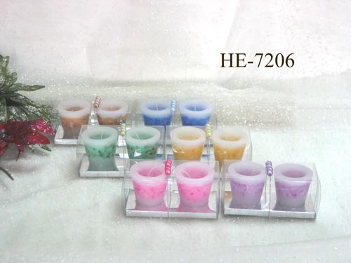 Scented pillar candles with colored wax pieces inside